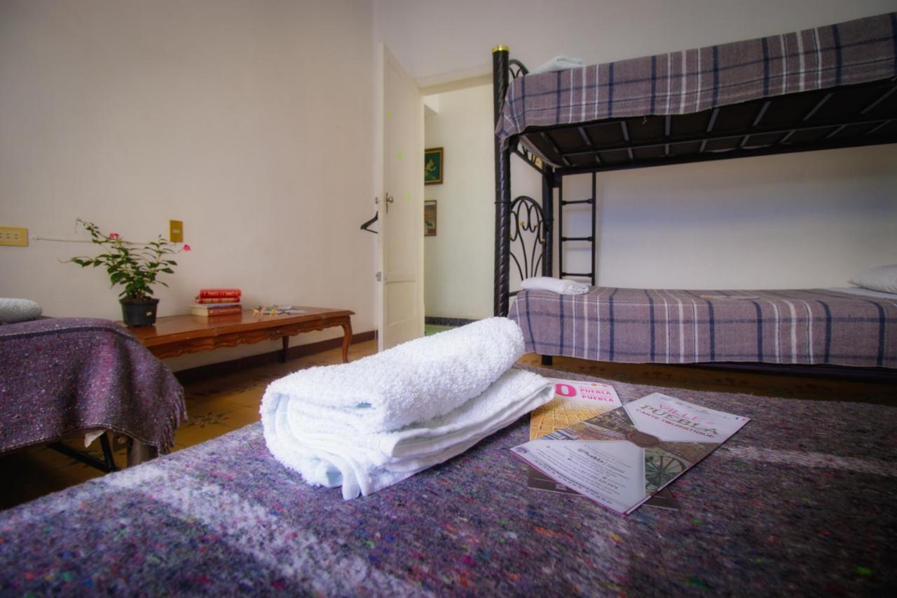 Cama individual en habitación compartida